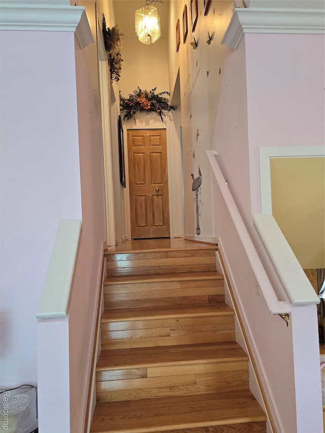 5605 Northcrest Xing, Clarkston, MI 48346 - stairs with wood finished floors and a chandelier