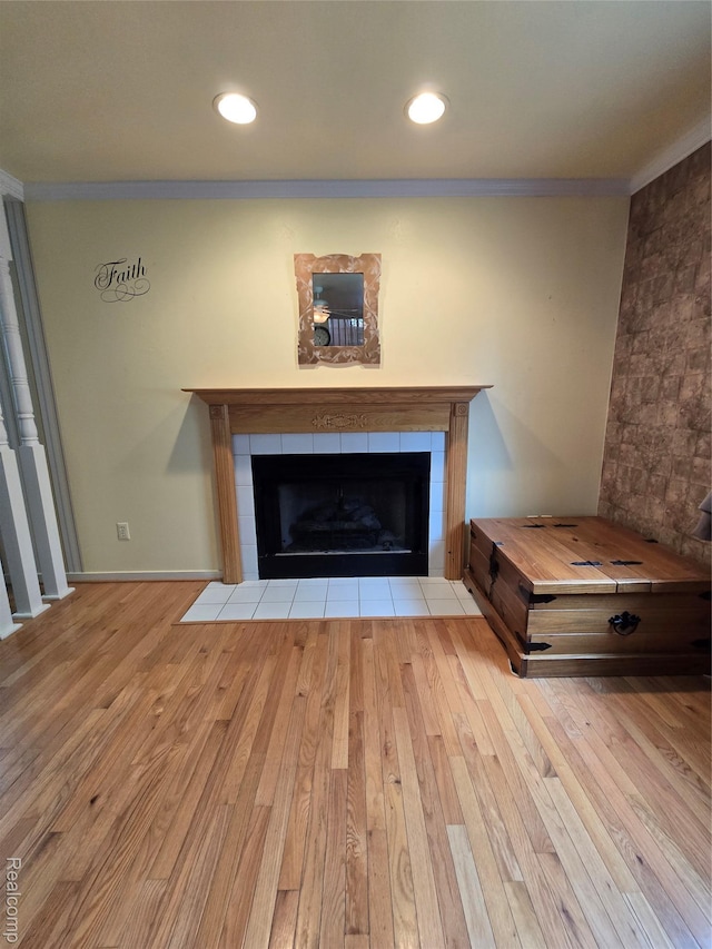 5605 Northcrest Xing, Clarkston, MI 48346 - detailed view of a fireplace, wood finished floors, ornamental molding, and recessed lighting
