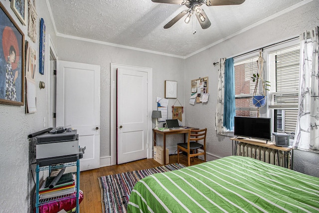 2313 S Westnedge Ave, Kalamazoo, MI 49008 - bedroom featuring a textured wall, hardwood / wood-style flooring, a textured ceiling, crown molding, and an office area