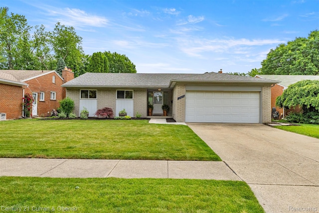 17276 Midway Ave, Allen Park, MI 48101 - ranch-style house featuring brick siding, a garage, driveway, and a front yard