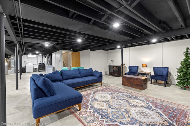 17276 Midway Ave, Allen Park, MI 48101 - living room with independent washer and dryer, concrete floors, and stairs