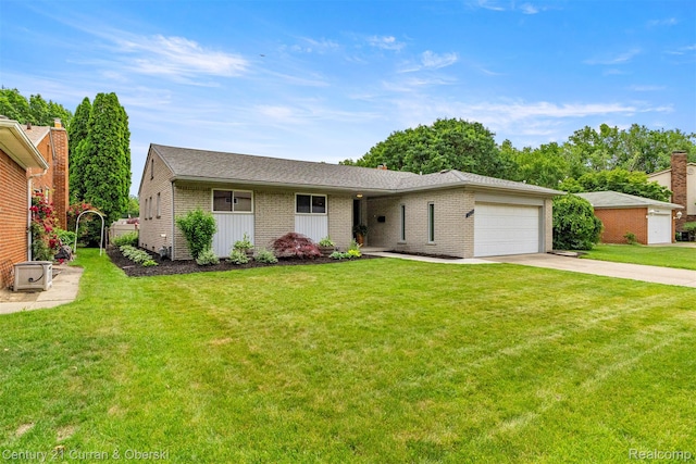 17276 Midway Ave, Allen Park, MI 48101 - view of front of property featuring a garage, driveway, a front lawn, brick siding, and roof with shingles