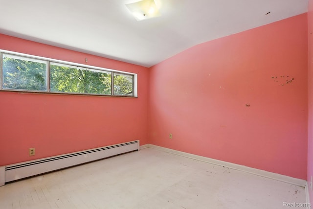 45411 Sterritt St, Utica, MI 48317 - spare room with baseboard heating, lofted ceiling, and concrete floors