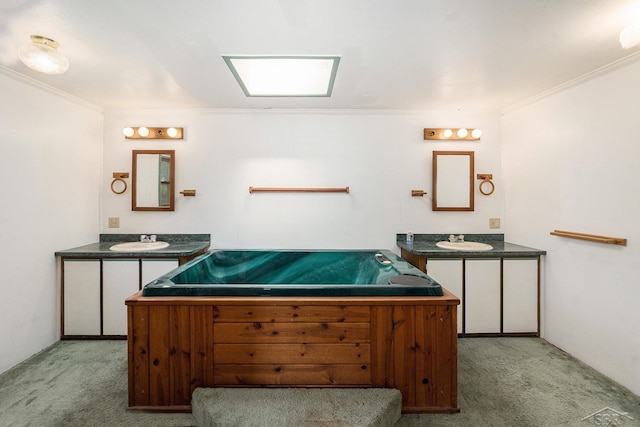11816 Morton Rd, Manistee, MI 49660 - full bath featuring crown molding, two vanities, and a bathtub