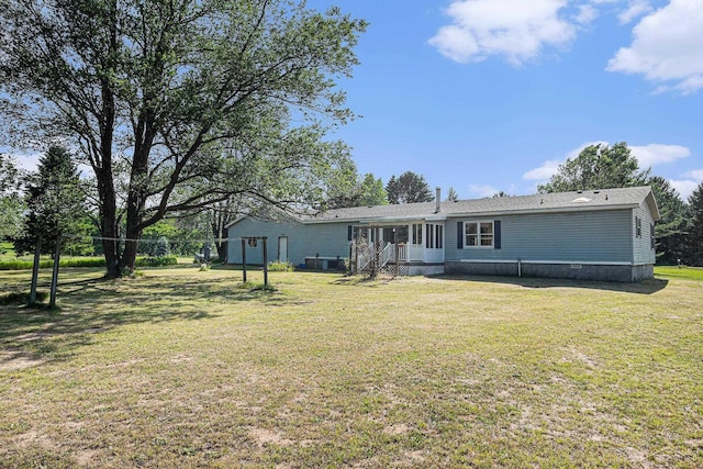 11816 Morton Rd, Manistee, MI 49660 - rear view of house with a lawn