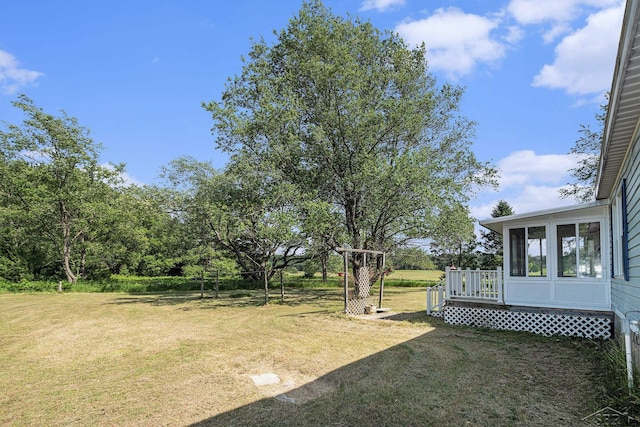 11816 Morton Rd, Manistee, MI 49660 - view of green lawn with a deck