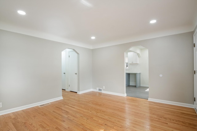 9250 Rosedale Blvd, Allen Park, MI 48101 - unfurnished room featuring arched walkways, light wood-style flooring, and recessed lighting