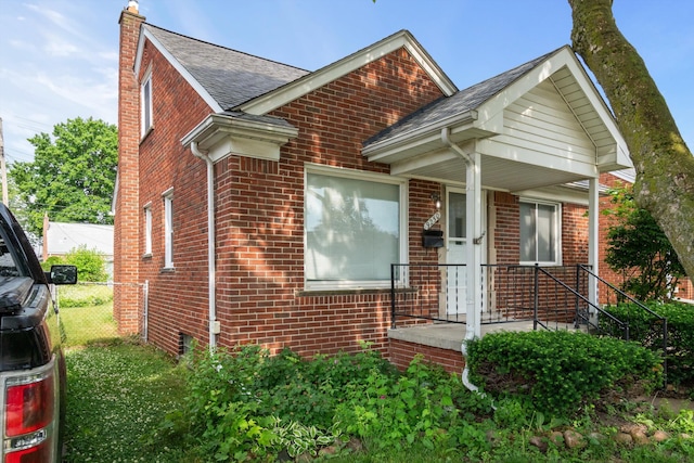 9250 Rosedale Blvd, Allen Park, MI 48101 - view of front of house with brick siding, a chimney, and roof with shingles