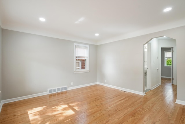 9250 Rosedale Blvd, Allen Park, MI 48101 - empty room featuring arched walkways, plenty of natural light, light wood-style flooring, and recessed lighting