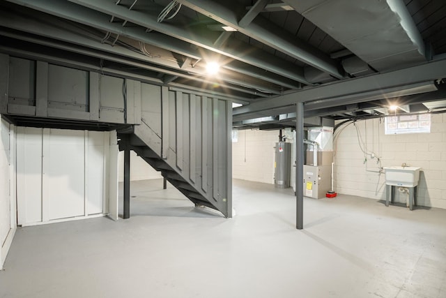 9250 Rosedale Blvd, Allen Park, MI 48101 - below grade area featuring heating unit, stairway, water heater, and concrete block wall