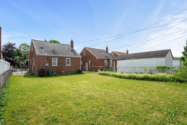 9250 Rosedale Blvd, Allen Park, MI 48101 - back of house featuring brick siding and a chimney