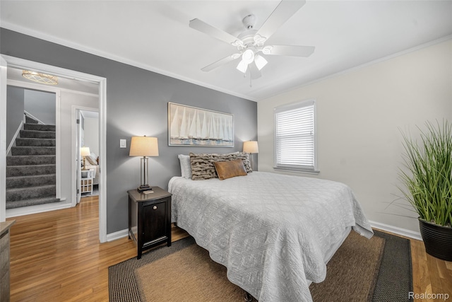 2195 Pembroke Rd, Birmingham, MI 48009 - bedroom featuring ornamental molding, wood finished floors, and a ceiling fan