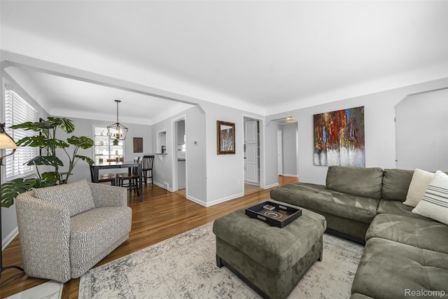2195 Pembroke Rd, Birmingham, MI 48009 - living room featuring wood finished floors and a chandelier
