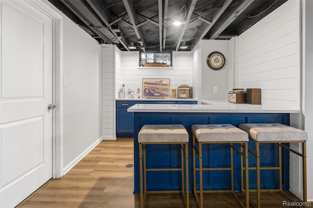 2195 Pembroke Rd, Birmingham, MI 48009 - indoor dry bar featuring light wood finished floors and wooden walls