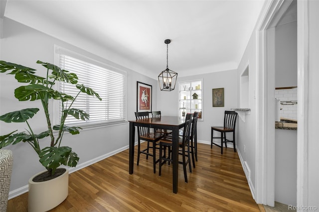 2195 Pembroke Rd, Birmingham, MI 48009 - dining space featuring wood finished floors and a chandelier