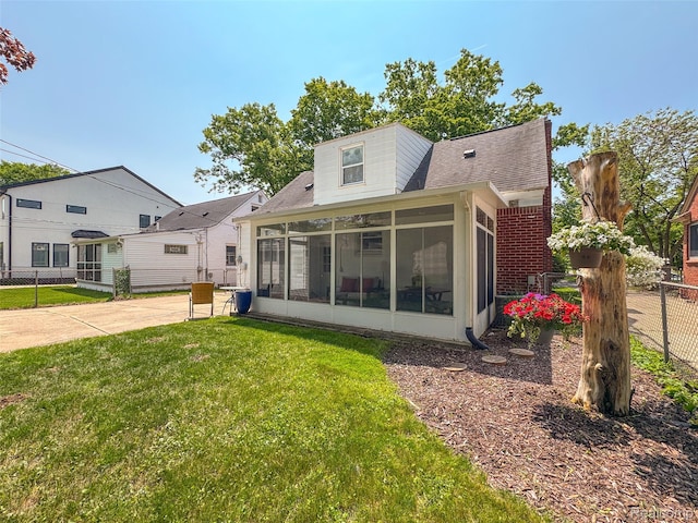2195 Pembroke Rd, Birmingham, MI 48009 - rear view of property featuring a sunroom and a shingled roof
