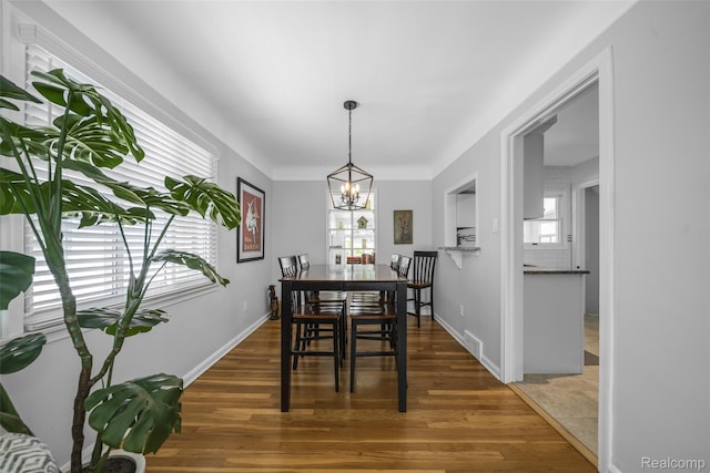 2195 Pembroke Rd, Birmingham, MI 48009 - dining area featuring plenty of natural light, a chandelier, and wood finished floors