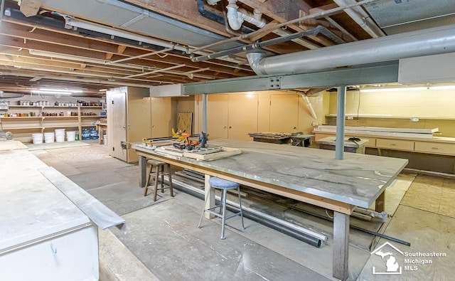 7007 Jackman Rd, Temperance, MI 48182 - unfinished basement featuring a workshop area