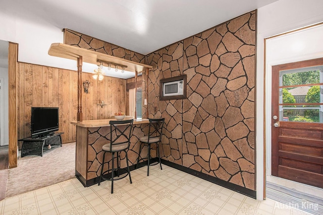 3156 Tuell St NW, Grand Rapids, MI 49504 - indoor bar featuring light flooring and wood walls