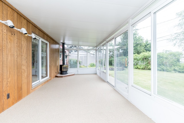 36067 Rolf St, Westland, MI 48186 - unfurnished sunroom with plenty of natural light and a wood stove