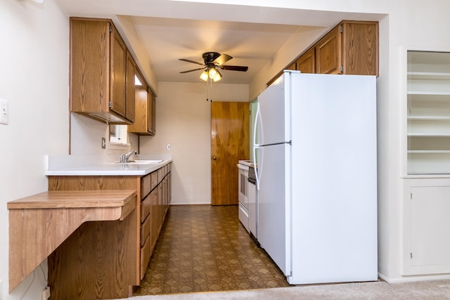 36067 Rolf St, Westland, MI 48186 - kitchen featuring white appliances, ceiling fan, brown cabinets, light countertops, and dark floors
