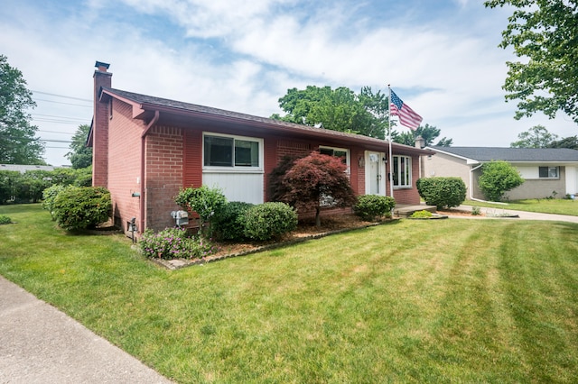 36067 Rolf St, Westland, MI 48186 - single story home with a chimney, brick siding, and a front lawn