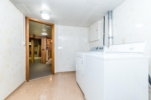 36067 Rolf St, Westland, MI 48186 - washroom with light wood-style flooring, washing machine and clothes dryer, and wallpapered walls