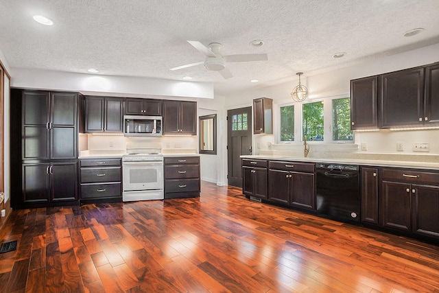 3536 Tamsin Ave, Kalamazoo, MI 49008 - kitchen with white range with electric cooktop, stainless steel microwave, black dishwasher, a textured ceiling, and light countertops