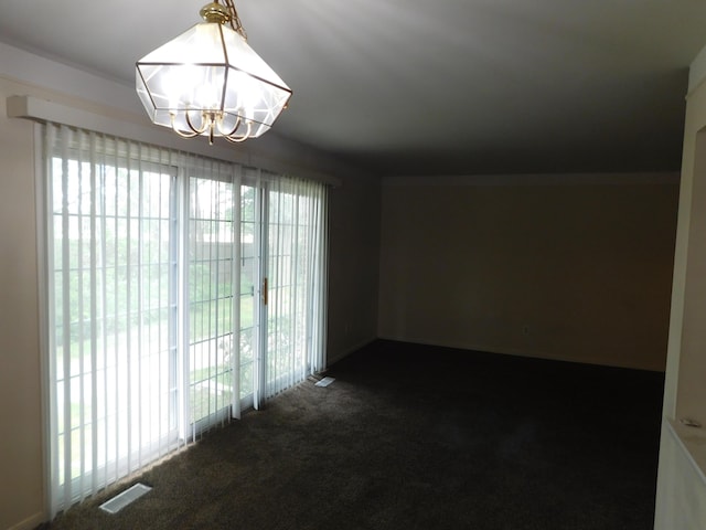 448 Fox Hills Dr S Unit 3, Bloomfield Hills, MI 48304 - unfurnished room featuring dark carpet and a chandelier