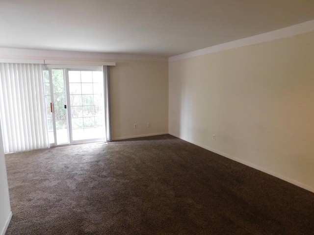 448 Fox Hills Dr S Unit 3, Bloomfield Hills, MI 48304 - unfurnished room featuring dark carpet and baseboards