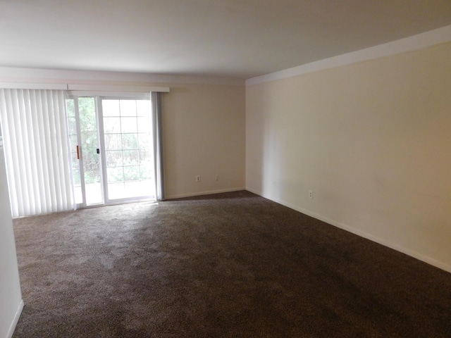 448 Fox Hills Dr S Unit 3, Bloomfield Hills, MI 48304 - spare room featuring dark carpet and baseboards