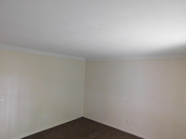 448 Fox Hills Dr S Unit 3, Bloomfield Hills, MI 48304 - spare room with dark colored carpet and baseboards