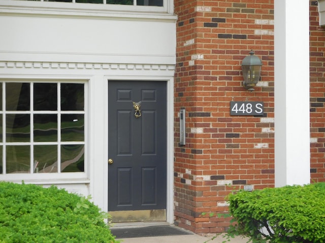 448 Fox Hills Dr S Unit 3, Bloomfield Hills, MI 48304 - view of exterior entry with brick siding