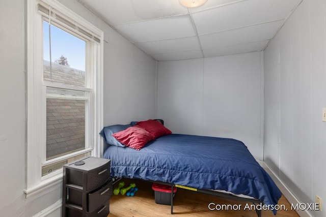 1523 Broadway Ave NW, Grand Rapids, MI 49504 - bedroom with a drop ceiling and wood finished floors