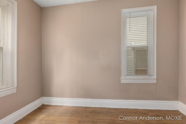 1523 Broadway Ave NW, Grand Rapids, MI 49504 - unfurnished room featuring baseboards and wood finished floors