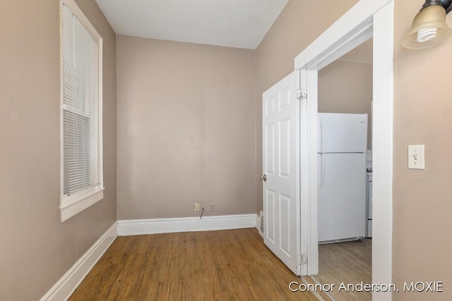 1523 Broadway Ave NW, Grand Rapids, MI 49504 - hallway with wood finished floors and baseboards