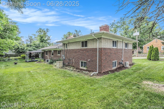 181 S Josephine Ave, Pontiac, MI 48341 - rear view of house featuring a chimney and brick siding