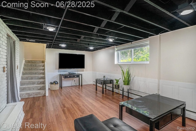 181 S Josephine Ave, Pontiac, MI 48341 - living room featuring a wainscoted wall, stairs, and wood finished floors