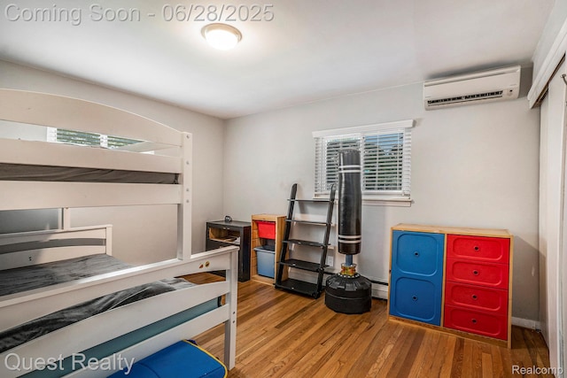 181 S Josephine Ave, Pontiac, MI 48341 - bedroom featuring a wall mounted AC and wood finished floors