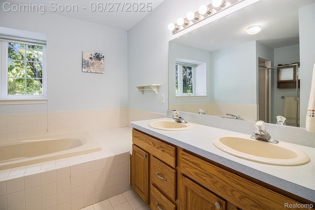 832 Townsend Dr, South Lyon, MI 48178 - full bathroom with double vanity, a garden tub, a shower stall, and tile patterned flooring