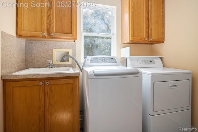 832 Townsend Dr, South Lyon, MI 48178 - laundry room featuring cabinet space and washing machine and clothes dryer