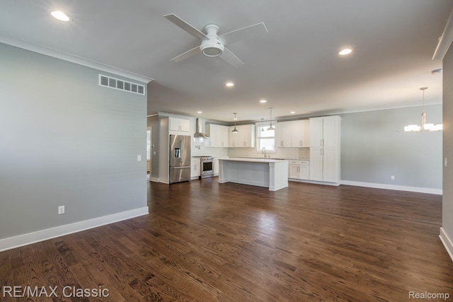 2663 Griffith Ave, Berkley, MI 48072 - unfurnished living room featuring a ceiling fan, crown molding, a chandelier, recessed lighting, and dark wood-style floors