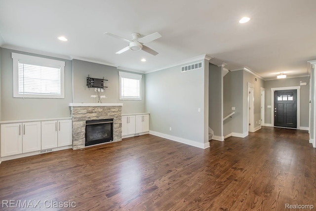 2663 Griffith Ave, Berkley, MI 48072 - unfurnished living room featuring ornamental molding, a ceiling fan, a fireplace, recessed lighting, and dark wood-type flooring
