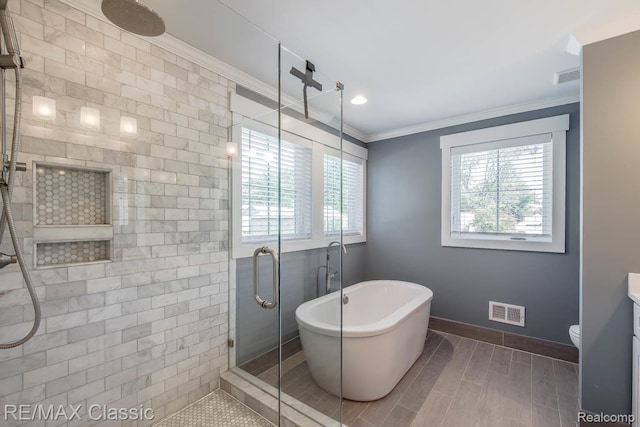 2663 Griffith Ave, Berkley, MI 48072 - full bathroom with a stall shower, ornamental molding, a soaking tub, vanity, and wood finish floors