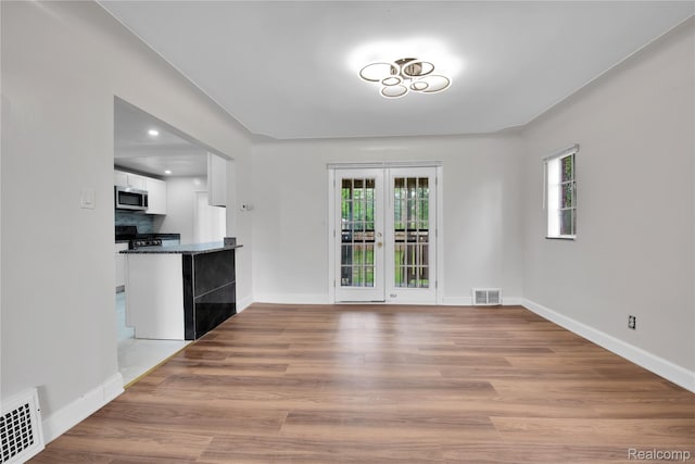 10825 E Outer Dr, Detroit, MI 48224 - unfurnished dining area featuring wood finished floors and recessed lighting