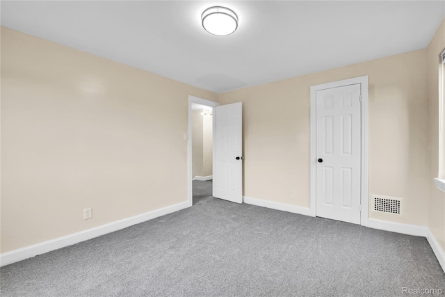 10825 E Outer Dr, Detroit, MI 48224 - unfurnished bedroom with carpet flooring and baseboards