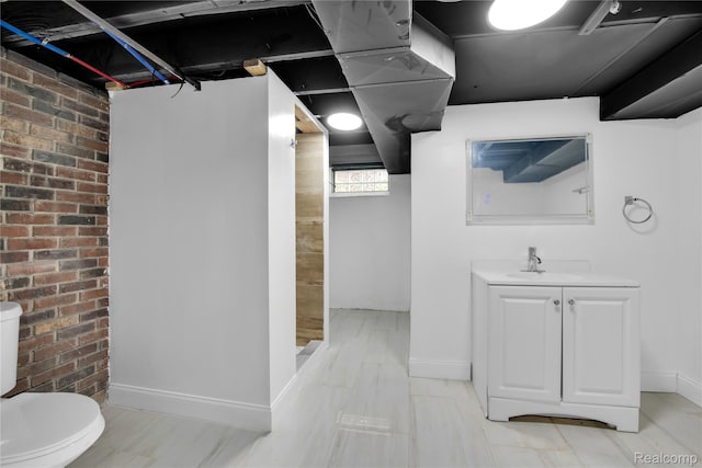 10825 E Outer Dr, Detroit, MI 48224 - full bathroom with vanity and brick wall
