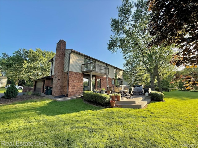 2546 Limerick Ln, Troy, MI 48098 - rear view of property with a balcony, a yard, a patio, a chimney, and brick siding