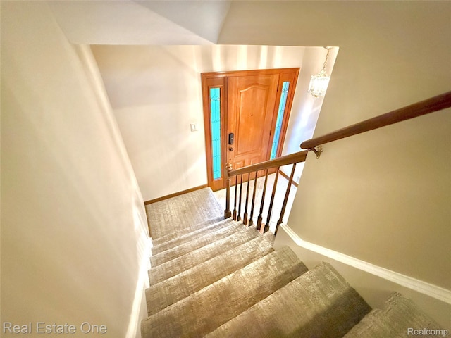 2546 Limerick Ln, Troy, MI 48098 - staircase with baseboards and a chandelier