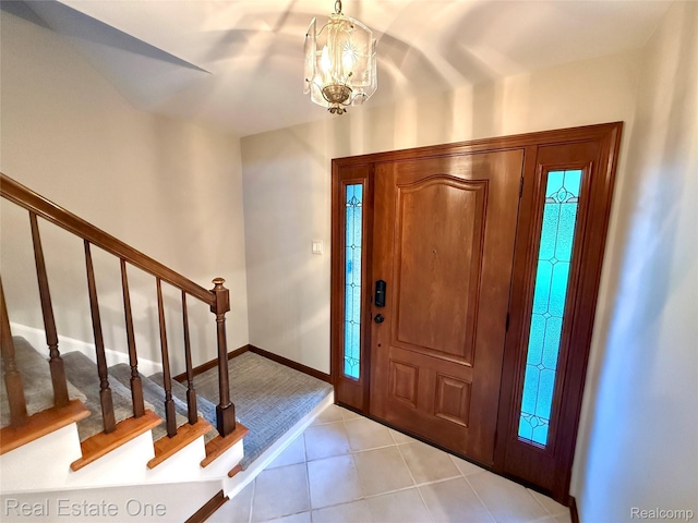 2546 Limerick Ln, Troy, MI 48098 - entrance foyer featuring light tile patterned floors, a chandelier, and stairway